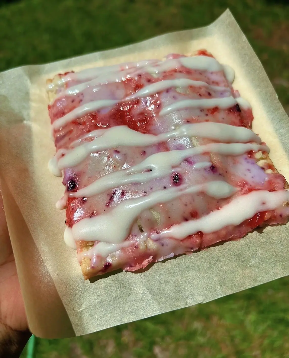 A berry Go-Tart finished with a white icing drizzle